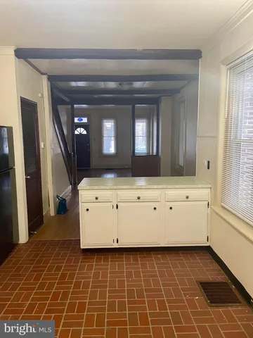 a view of room with window and hardwood floor