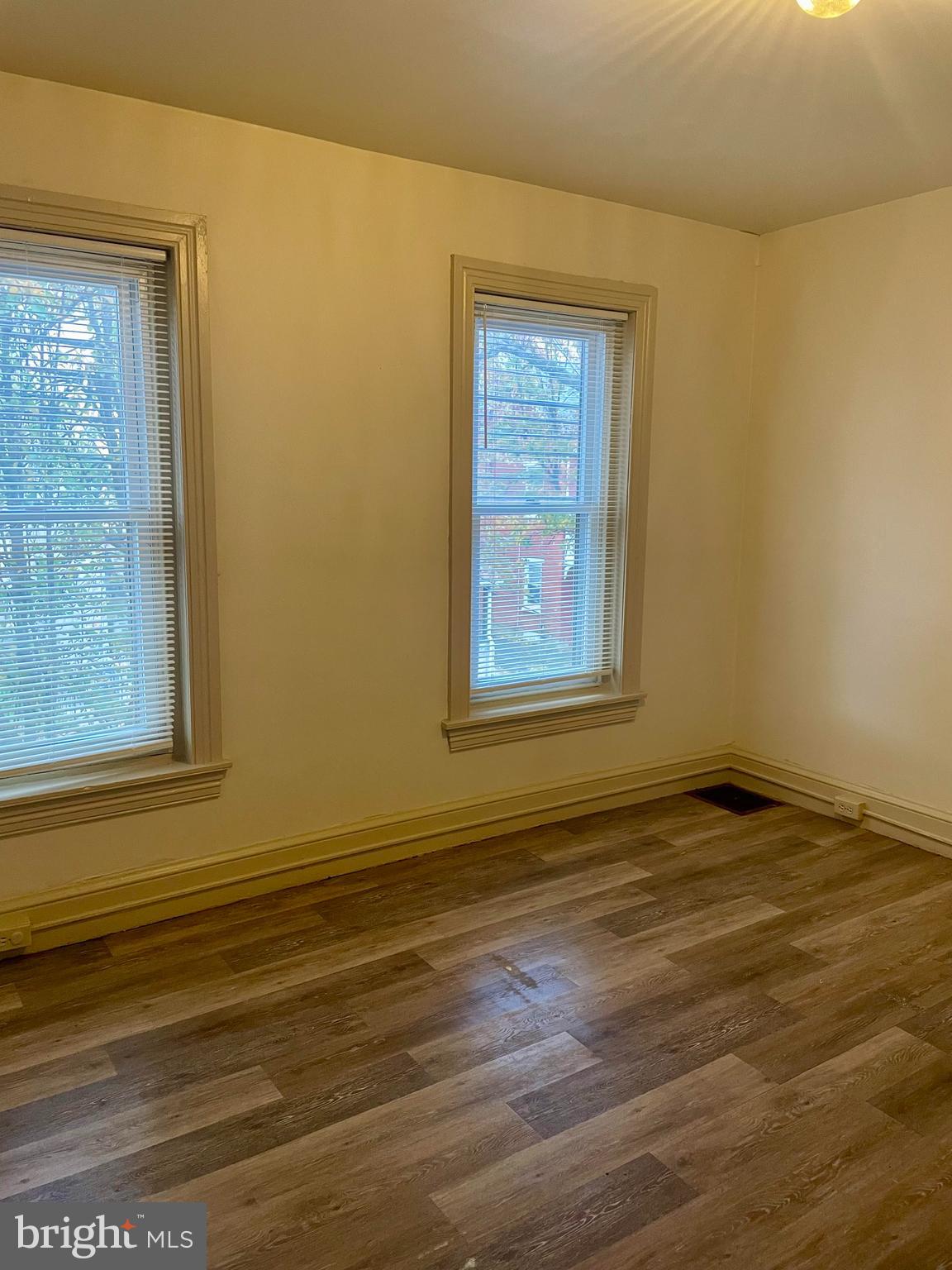 256 Beech Street Pottstown, PA 19464 - Photo 20 of 25 an empty room with wooden floor and windows