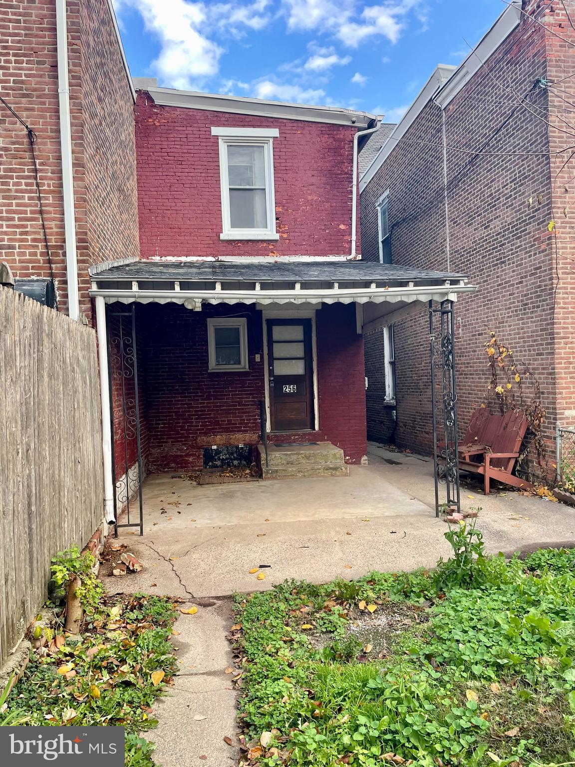 256 Beech Street Pottstown, PA 19464 - Photo 24 of 25 a view of a backyard with table and chairs with wooden fence