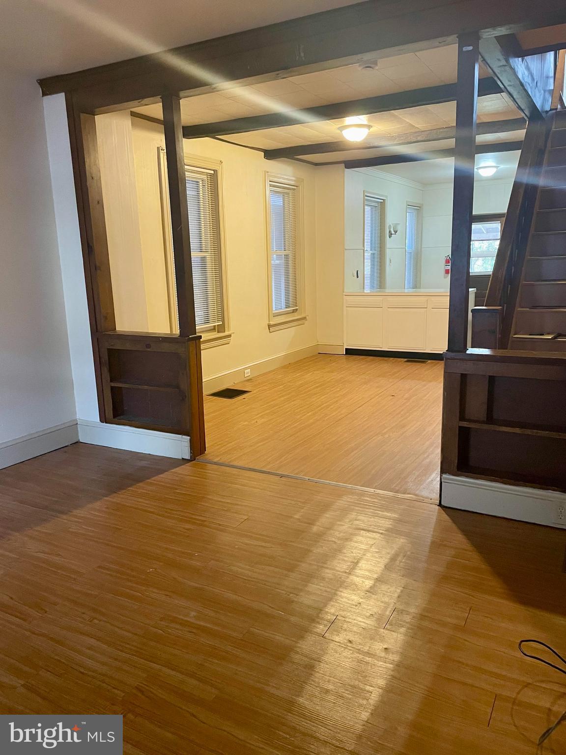 256 Beech Street Pottstown, PA 19464 - Photo 7 of 25 a view of an empty room with wooden floor and a window