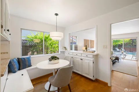 a view of a dining room with furniture window and outside view