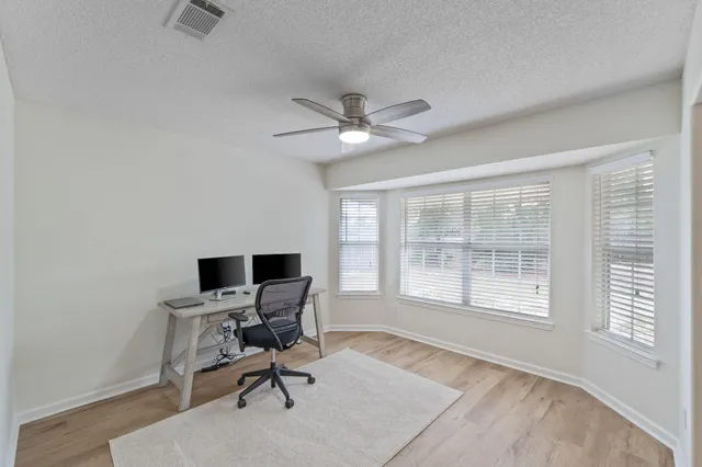 a workspace with furniture and a window
