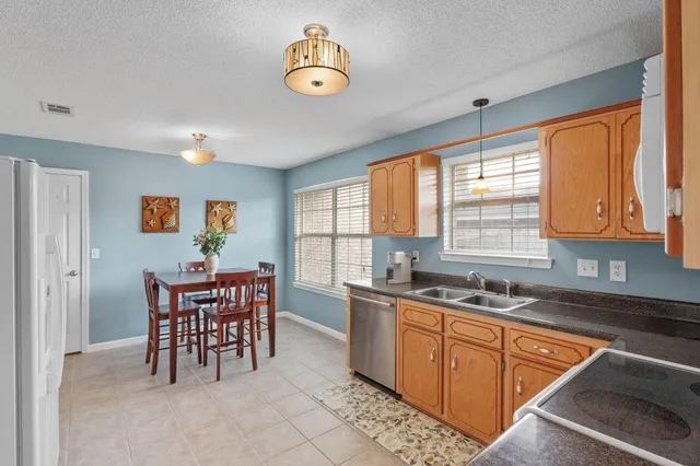 a kitchen that has a cabinets counter space and appliances in it