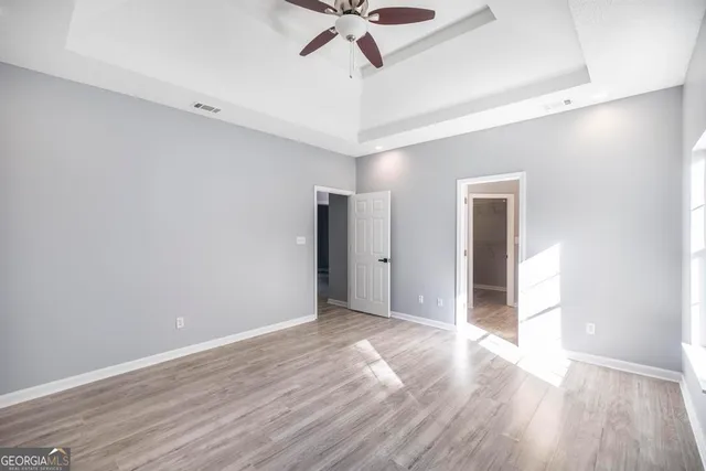 a view of an empty room with a window