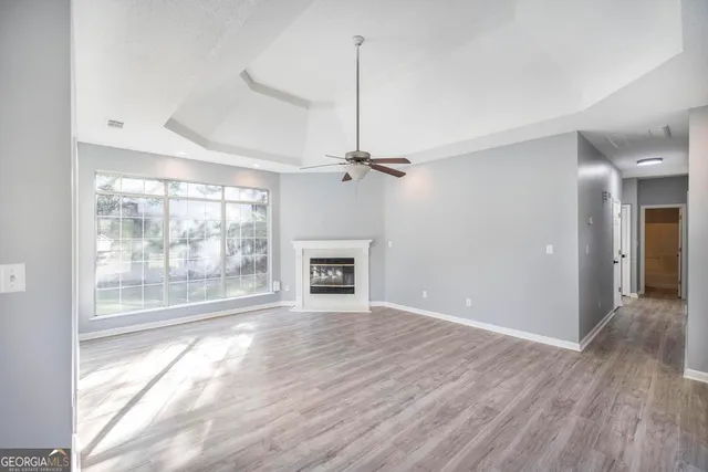 a view of livingroom with hardwood floor and a ceiling fan