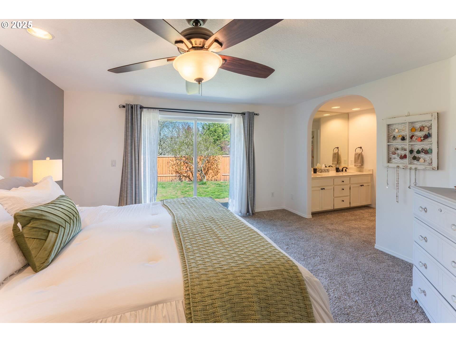 3983 Southeast 30th Street Gresham, OR 97080 - Photo 17 of 34 a spacious bedroom with a bed and a dresser
