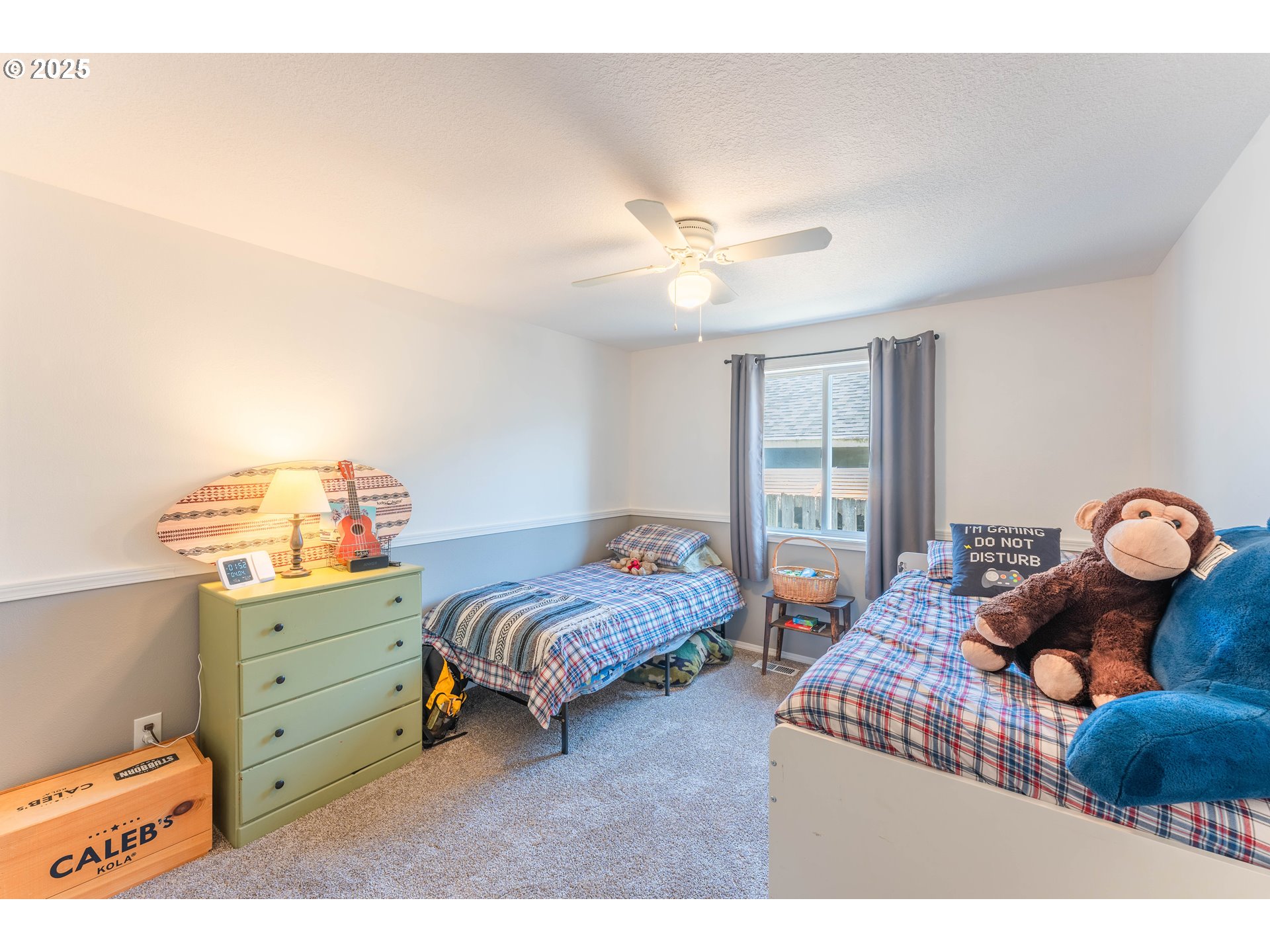 3983 Southeast 30th Street Gresham, OR 97080 - Photo 23 of 34 a bedroom with a bed and a chandelier