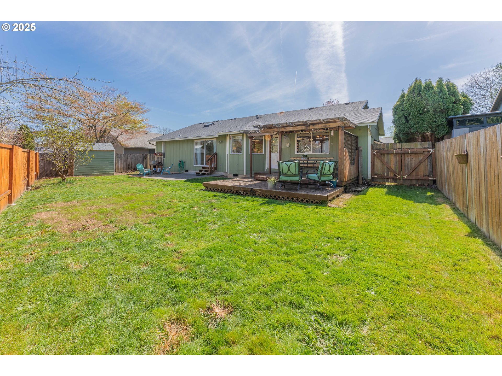 3983 Southeast 30th Street Gresham, OR 97080 - Photo 25 of 34 a view of a house with a big yard potted plants and large tree