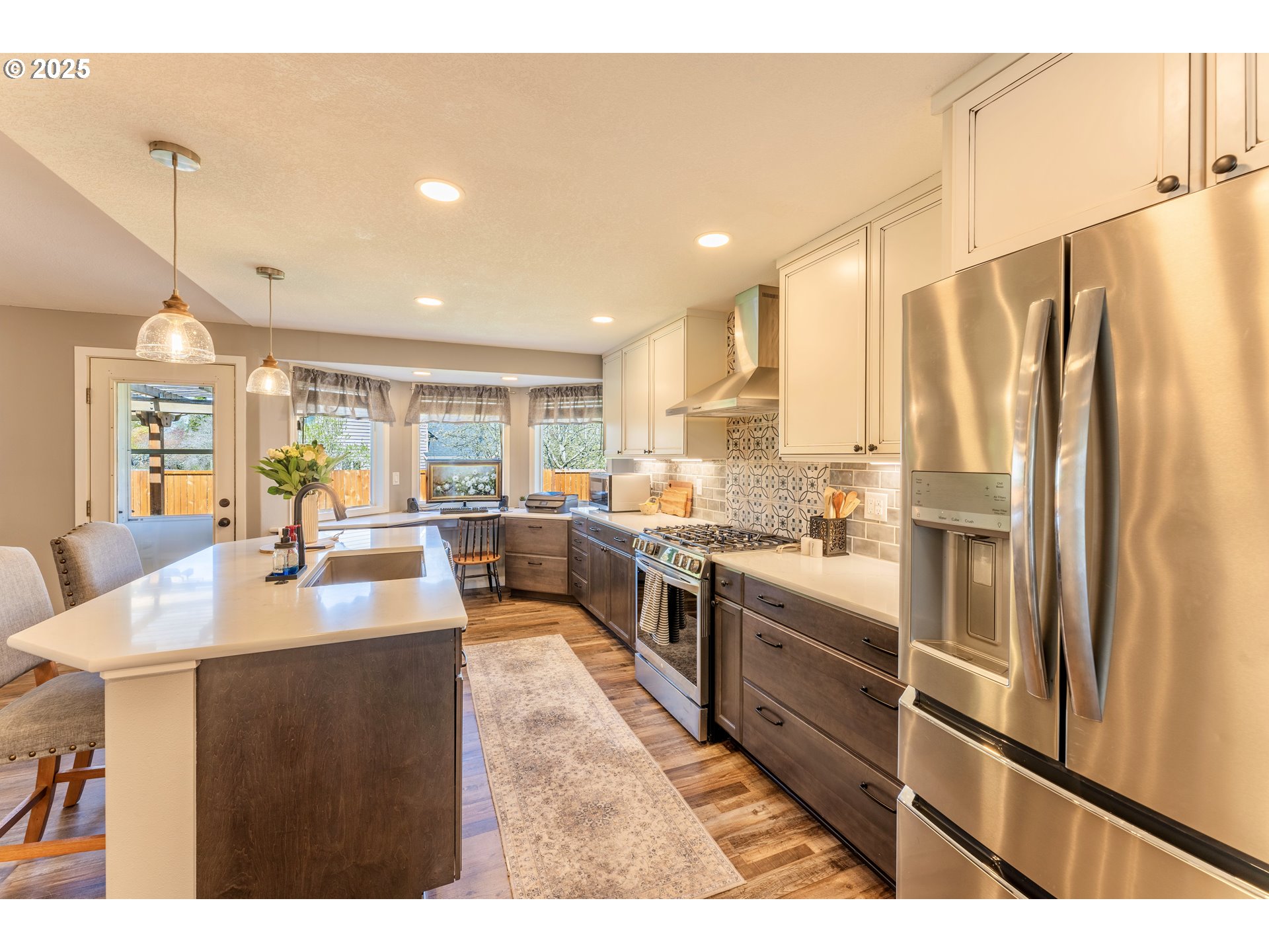 3983 Southeast 30th Street Gresham, OR 97080 - Photo 9 of 34 a kitchen with stainless steel appliances kitchen island granite countertop a refrigerator and a sink