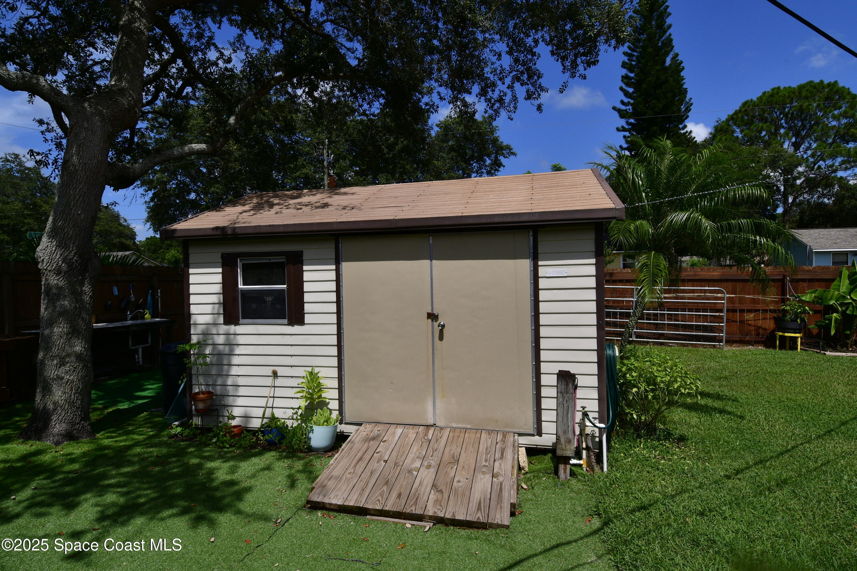 4501 Seattle Street Cocoa, FL 32927 - Photo 11 of 13 a view of a house with backyard and garden
