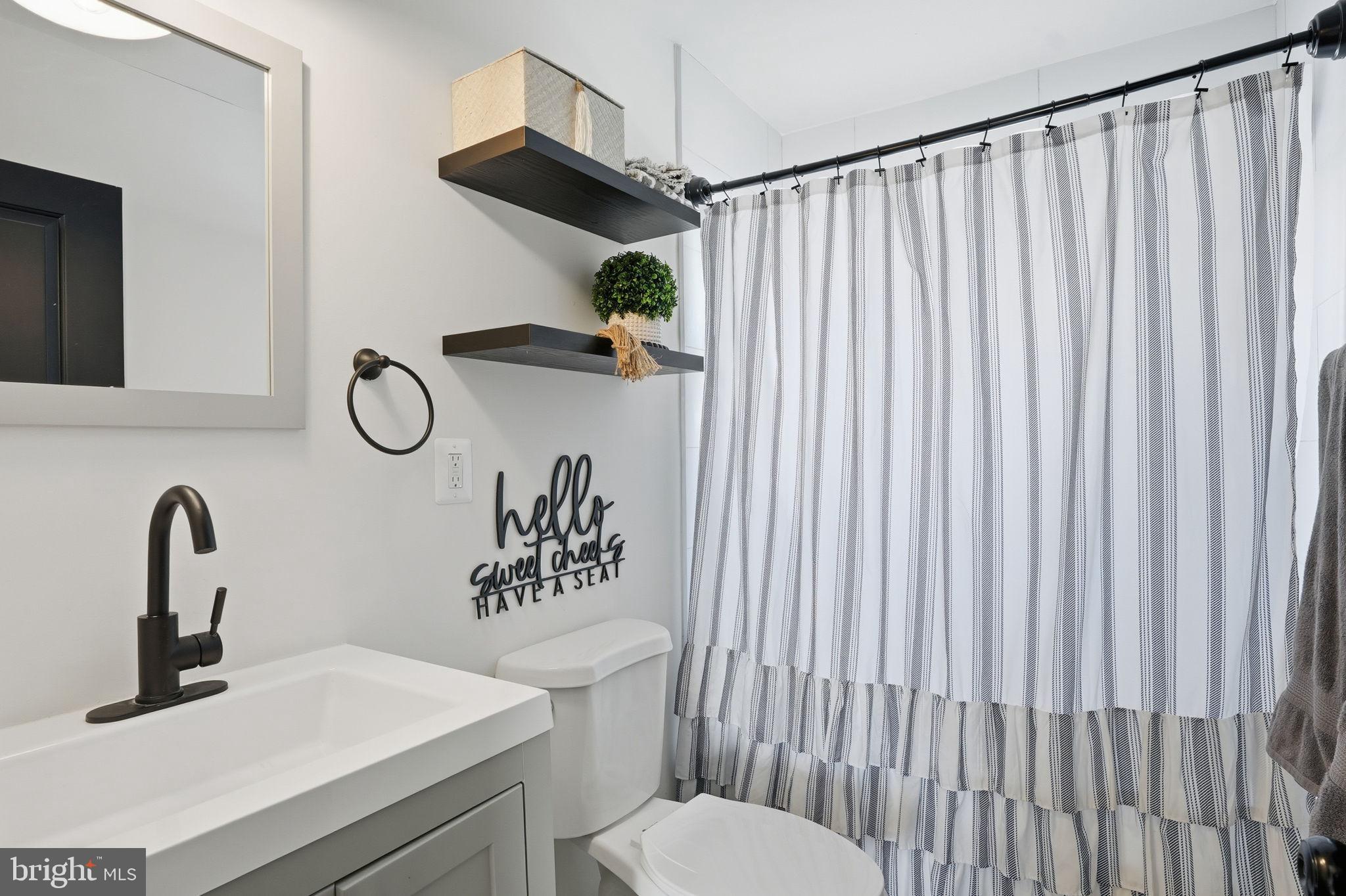 105 Michael Avenue Linthicum Heights, MD 21090 - Photo 20 of 24 a bathroom with a sink and a toilet