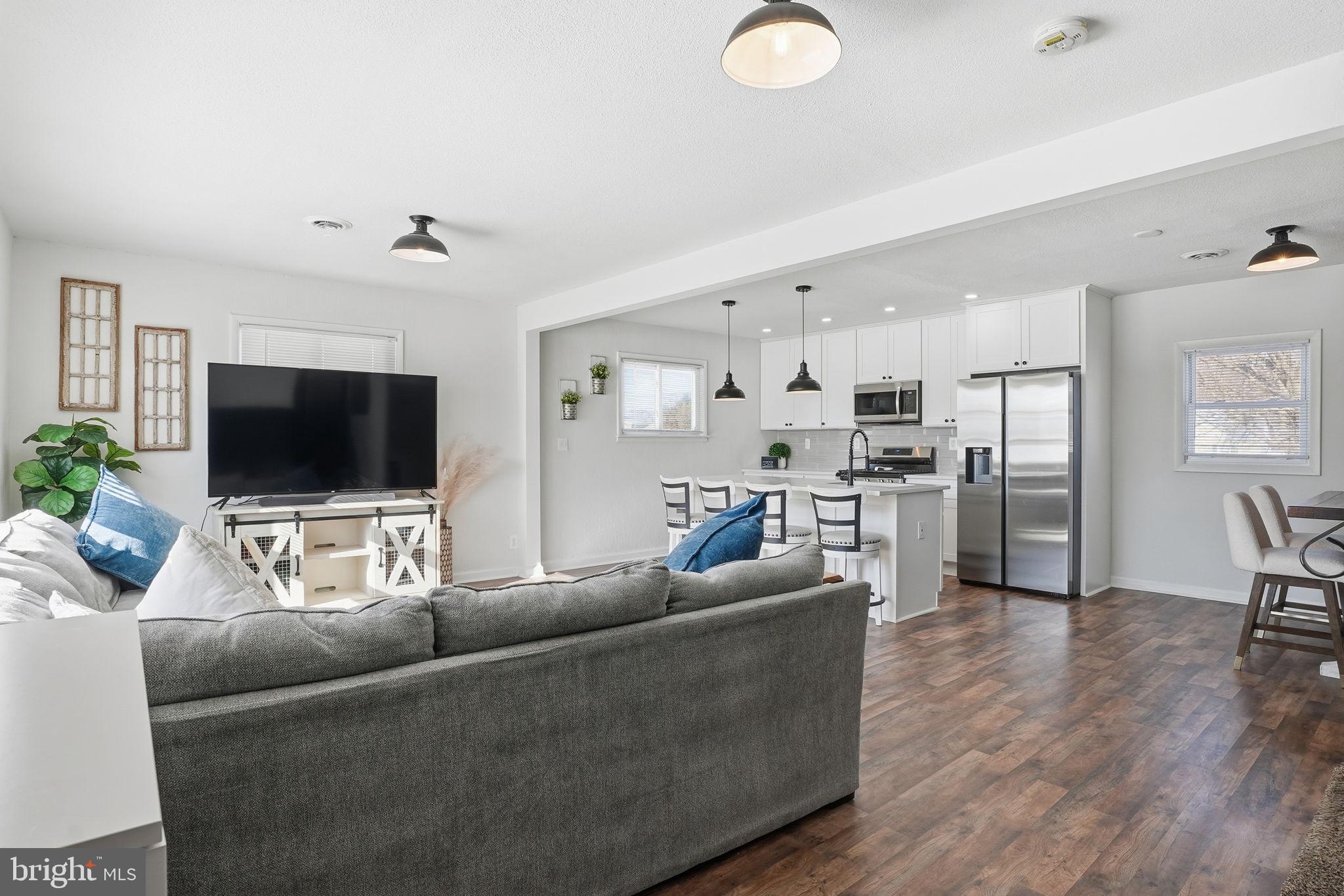105 Michael Avenue Linthicum Heights, MD 21090 - Photo 3 of 24 a living room with furniture and a flat screen tv