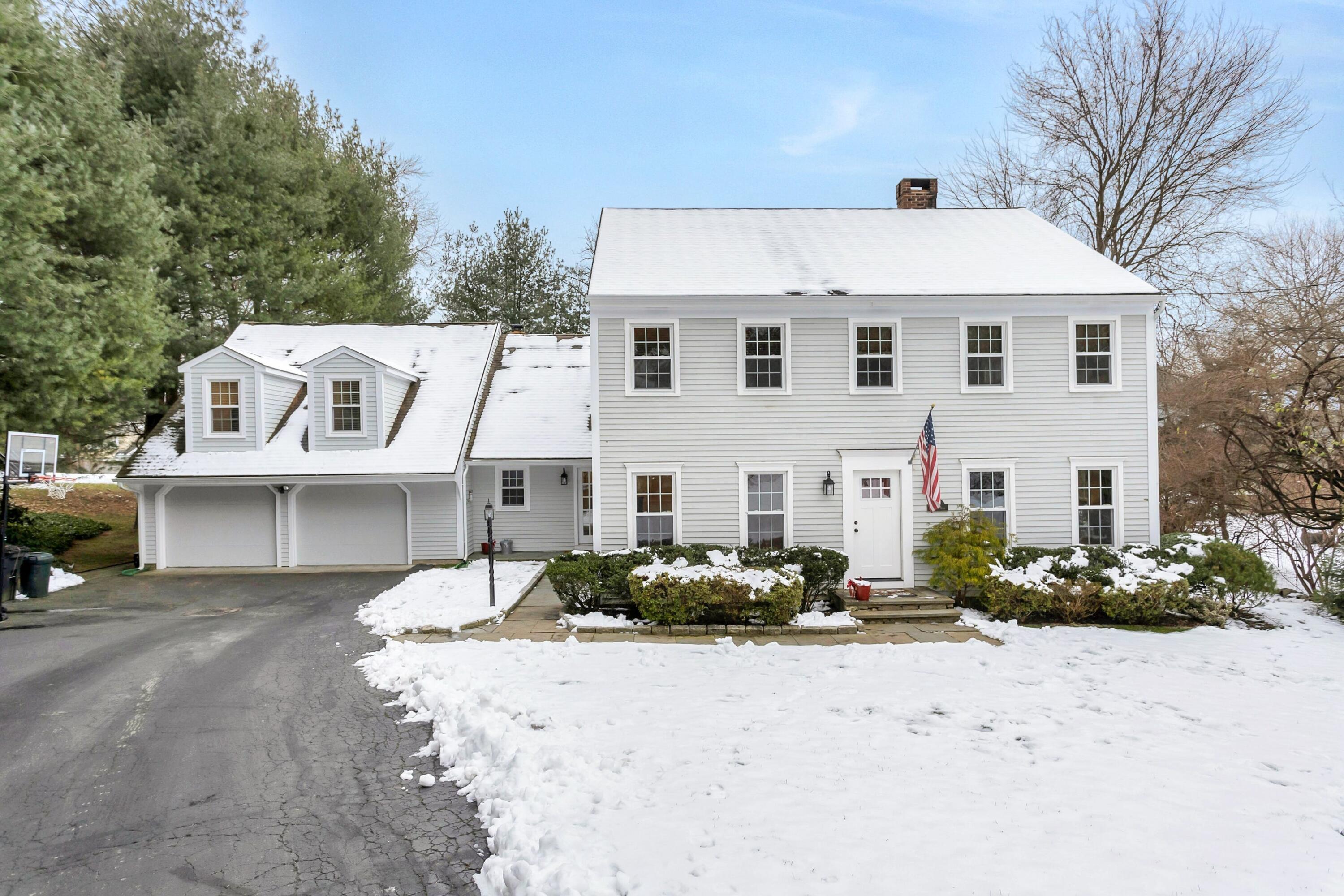 2 Red Barn Road Darien, CT 06820 - Photo 1 of 38 a view of a white house with a yard in front of it