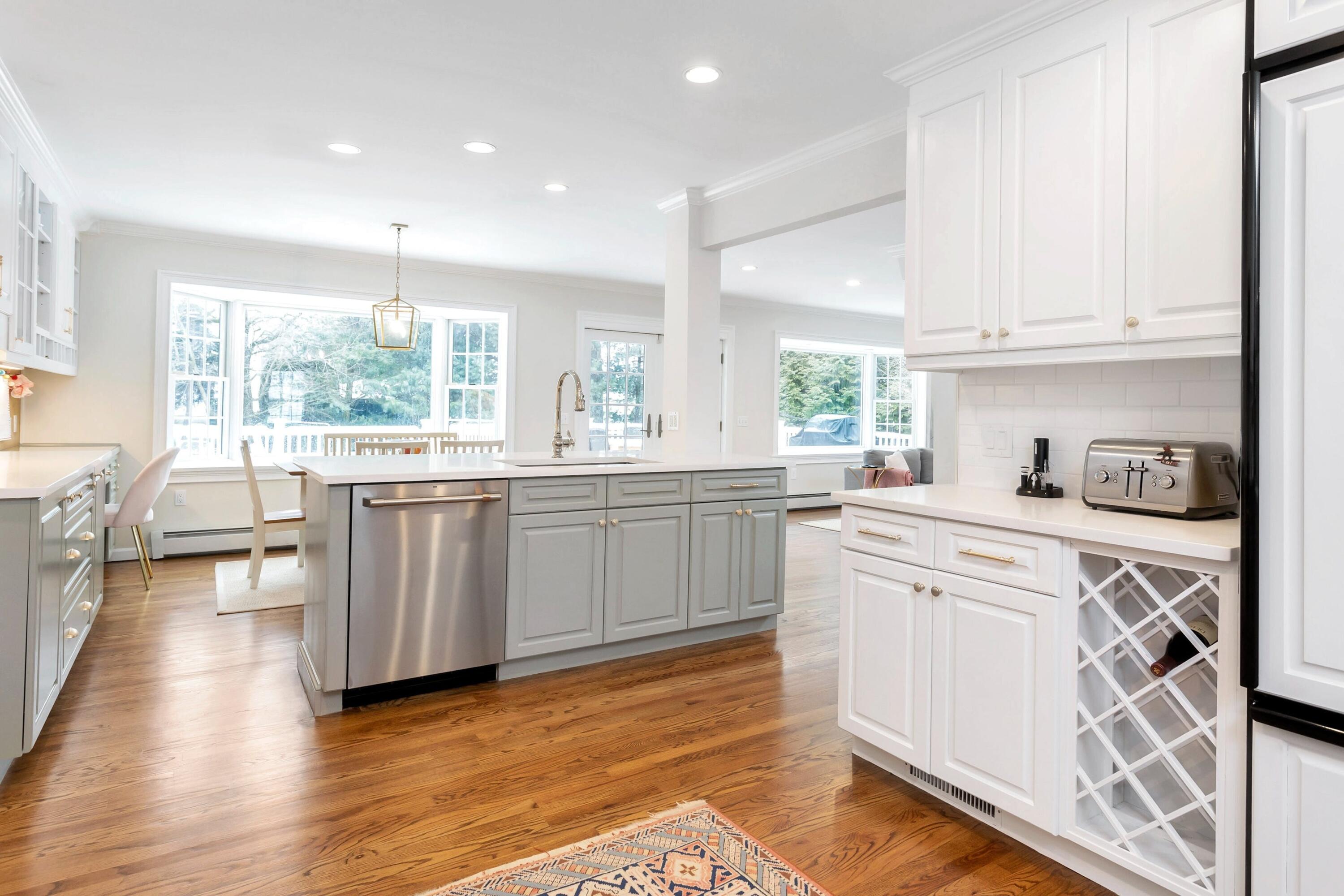 2 Red Barn Road Darien, CT 06820 - Photo 11 of 38 a kitchen with a sink window and cabinets