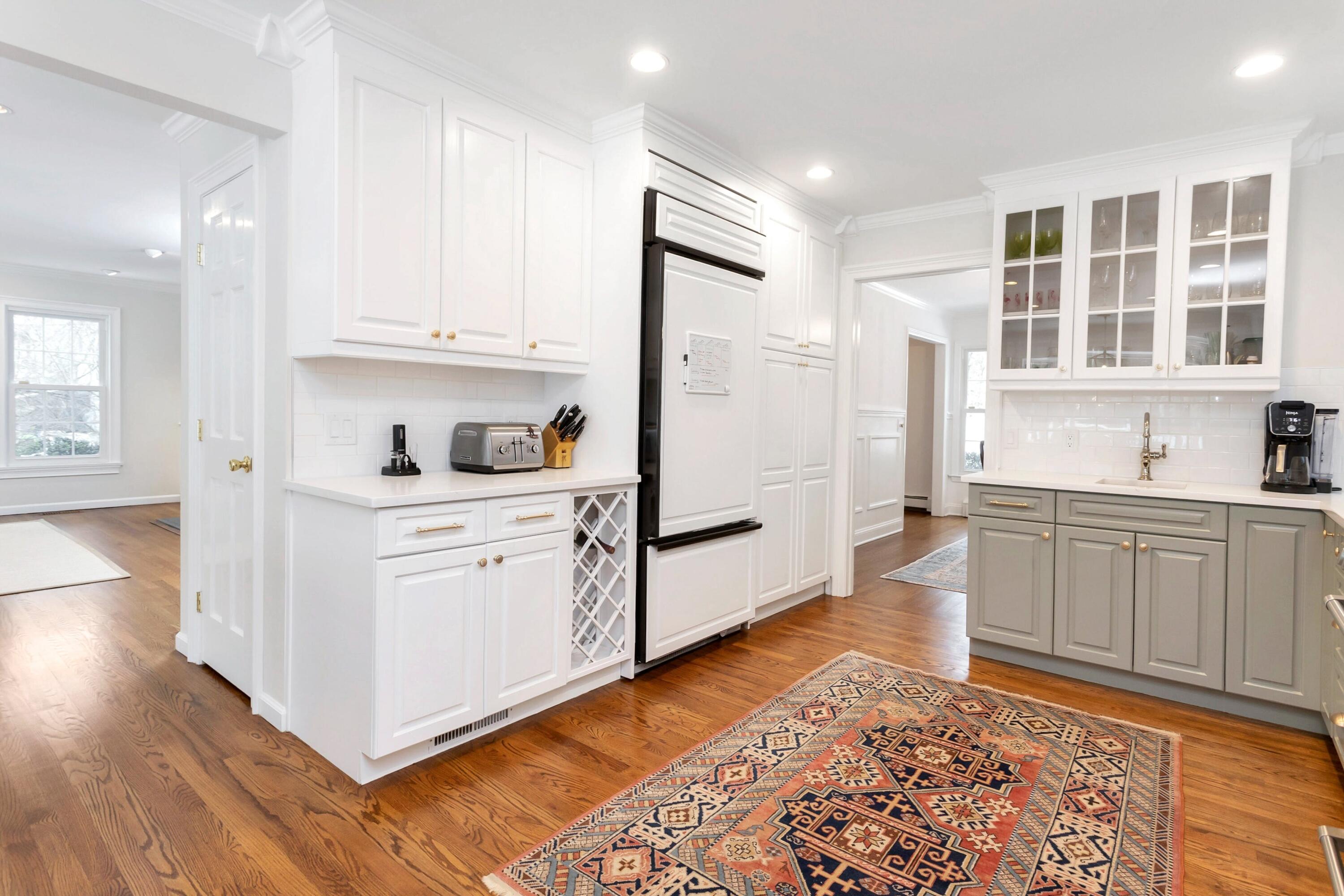2 Red Barn Road Darien, CT 06820 - Photo 13 of 38 a kitchen with granite countertop white cabinets and appliances