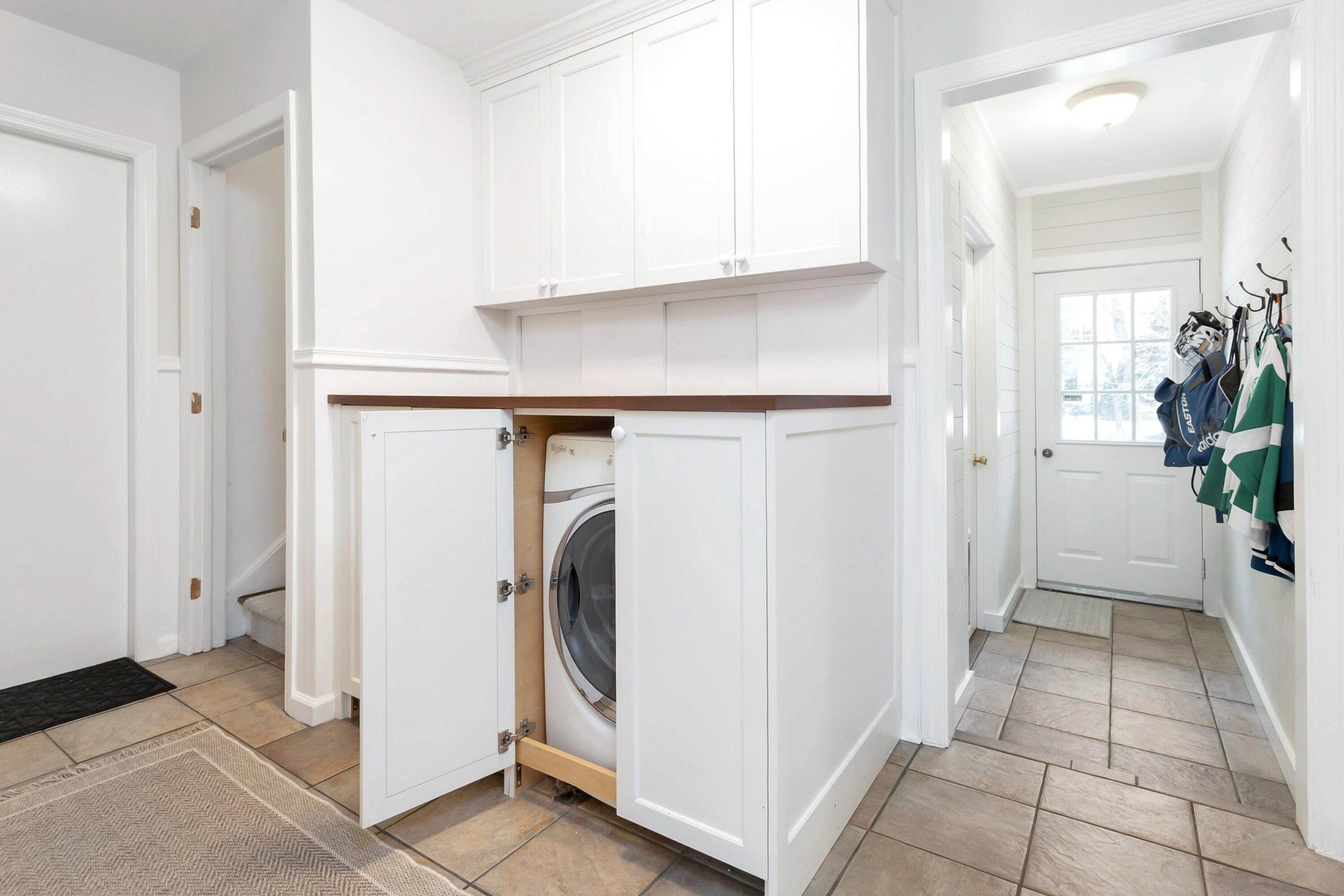 2 Red Barn Road Darien, CT 06820 - Photo 20 of 38 a view of a storage and utility room with washer and dryer