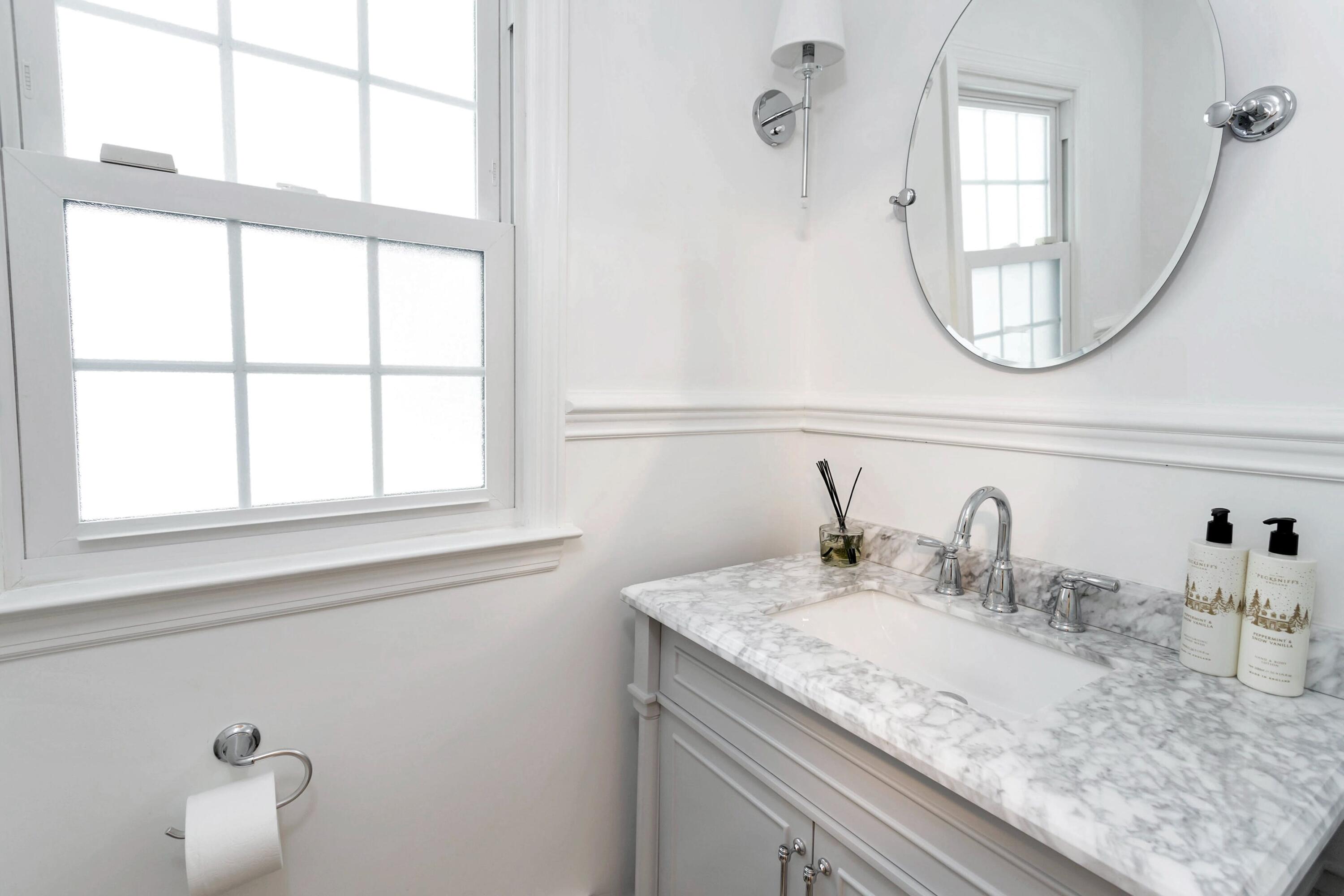 2 Red Barn Road Darien, CT 06820 - Photo 21 of 38 a bathroom with a granite countertop sink and a mirror