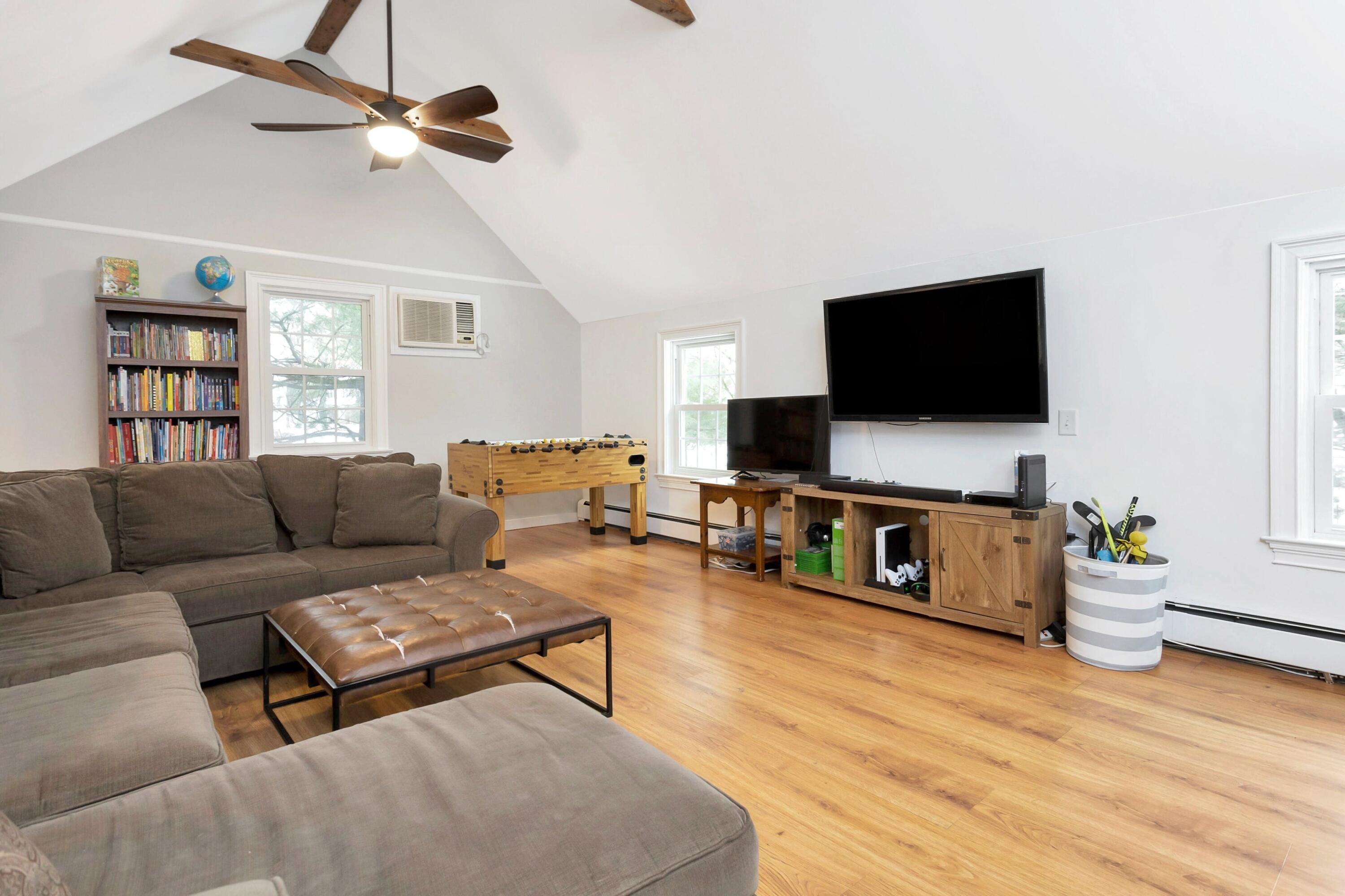 2 Red Barn Road Darien, CT 06820 - Photo 23 of 38 a living room with furniture and a flat screen tv