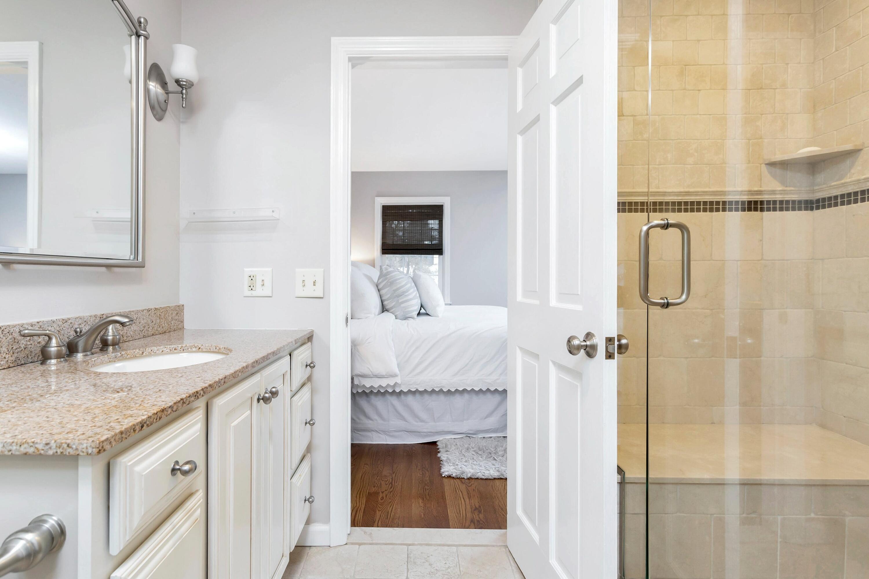 2 Red Barn Road Darien, CT 06820 - Photo 28 of 38 a en suite bathroom with a granite countertop sink and a mirror