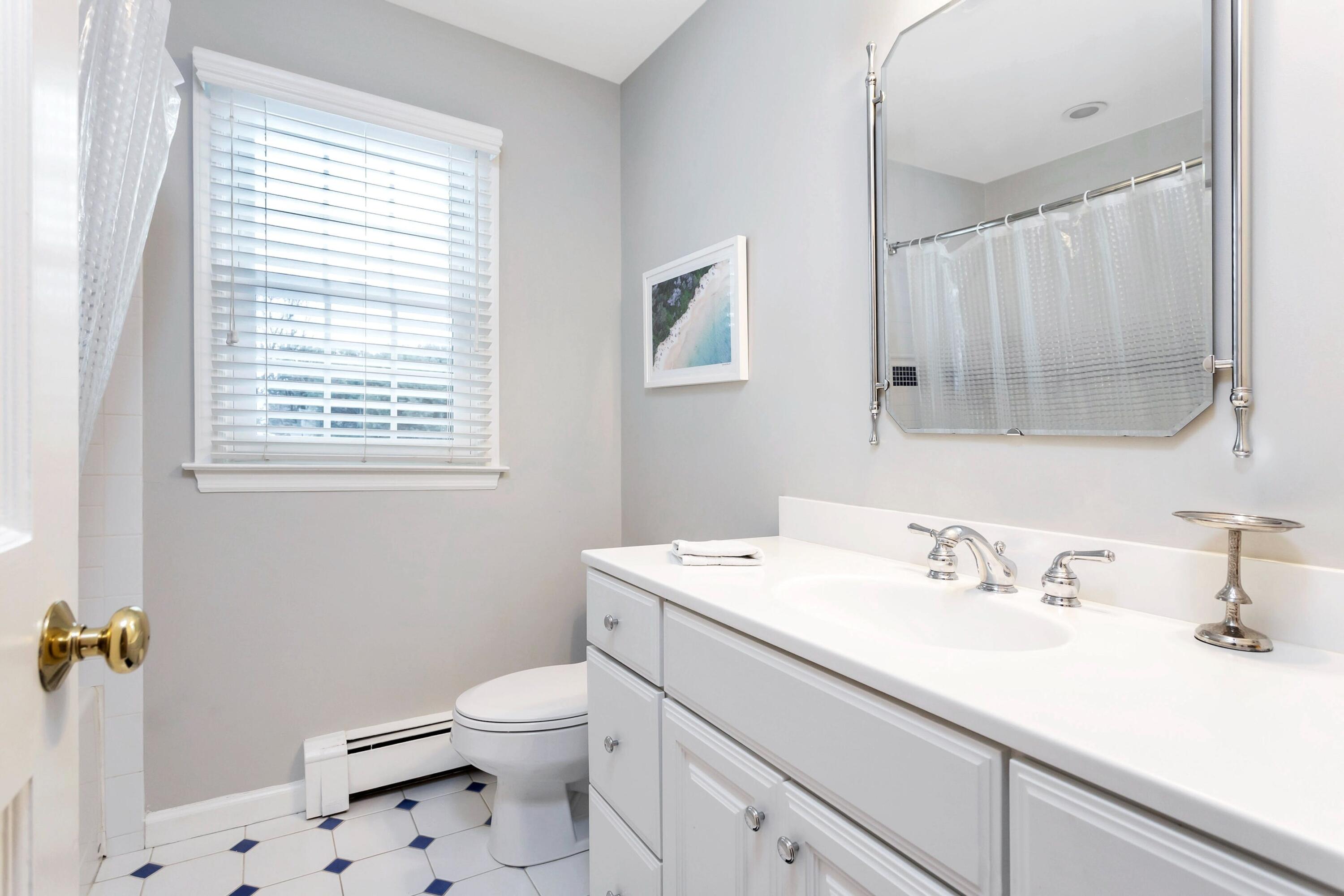 2 Red Barn Road Darien, CT 06820 - Photo 30 of 38 a bathroom with a sink a toilet and a mirror