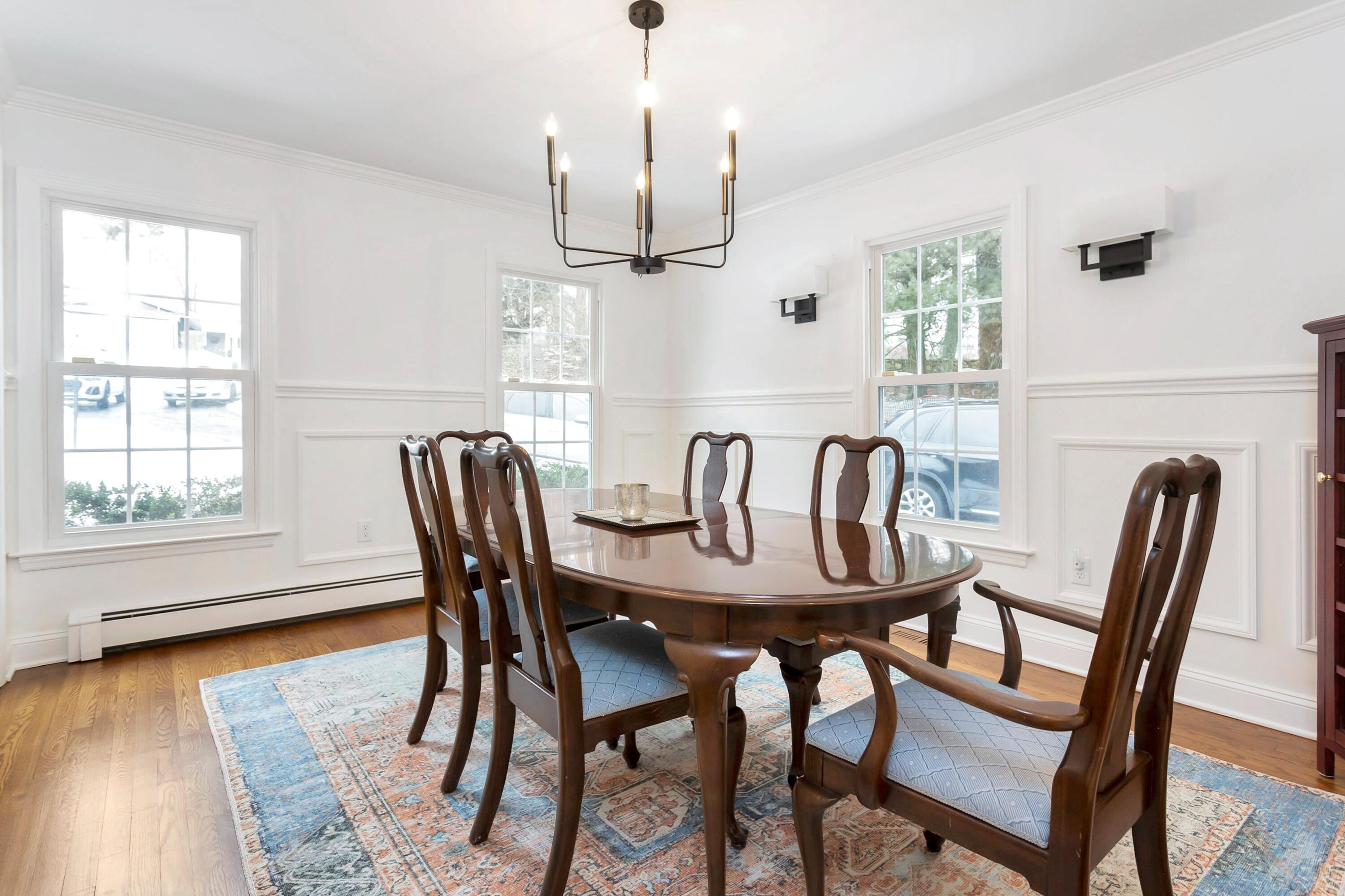 2 Red Barn Road Darien, CT 06820 - Photo 8 of 38 a view of a a dining room with furniture window and wooden floor