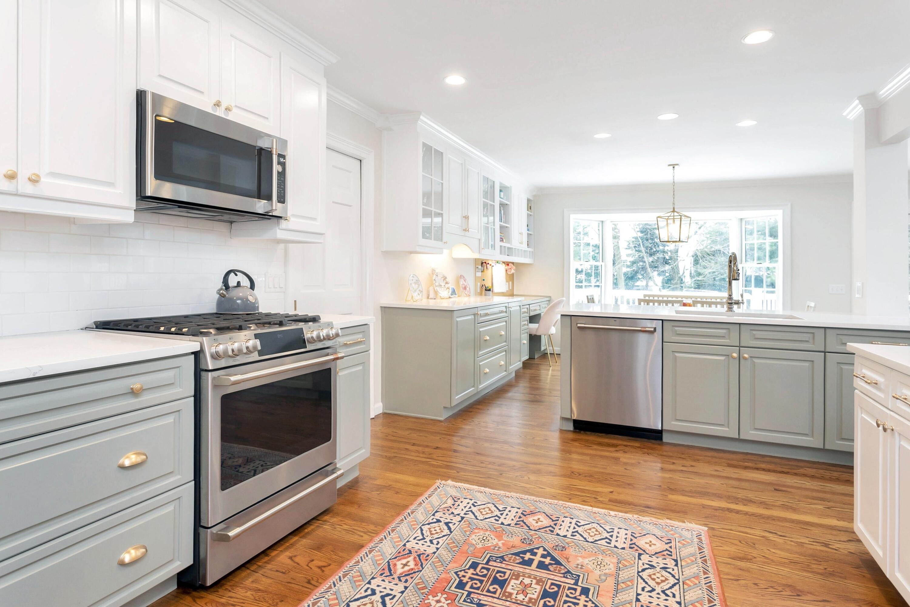 2 Red Barn Road Darien, CT 06820 - Photo 10 of 38 a kitchen with stainless steel appliances white cabinets a sink and a stove