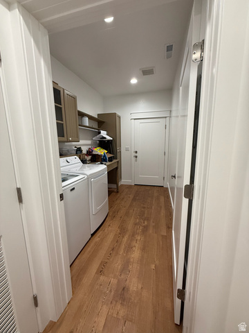 3550 North River Ln Road East Panguitch, UT 84759 - Photo 15 of 25 Laundry area featuring wood-finish flooring, recessed lighting, and white walls