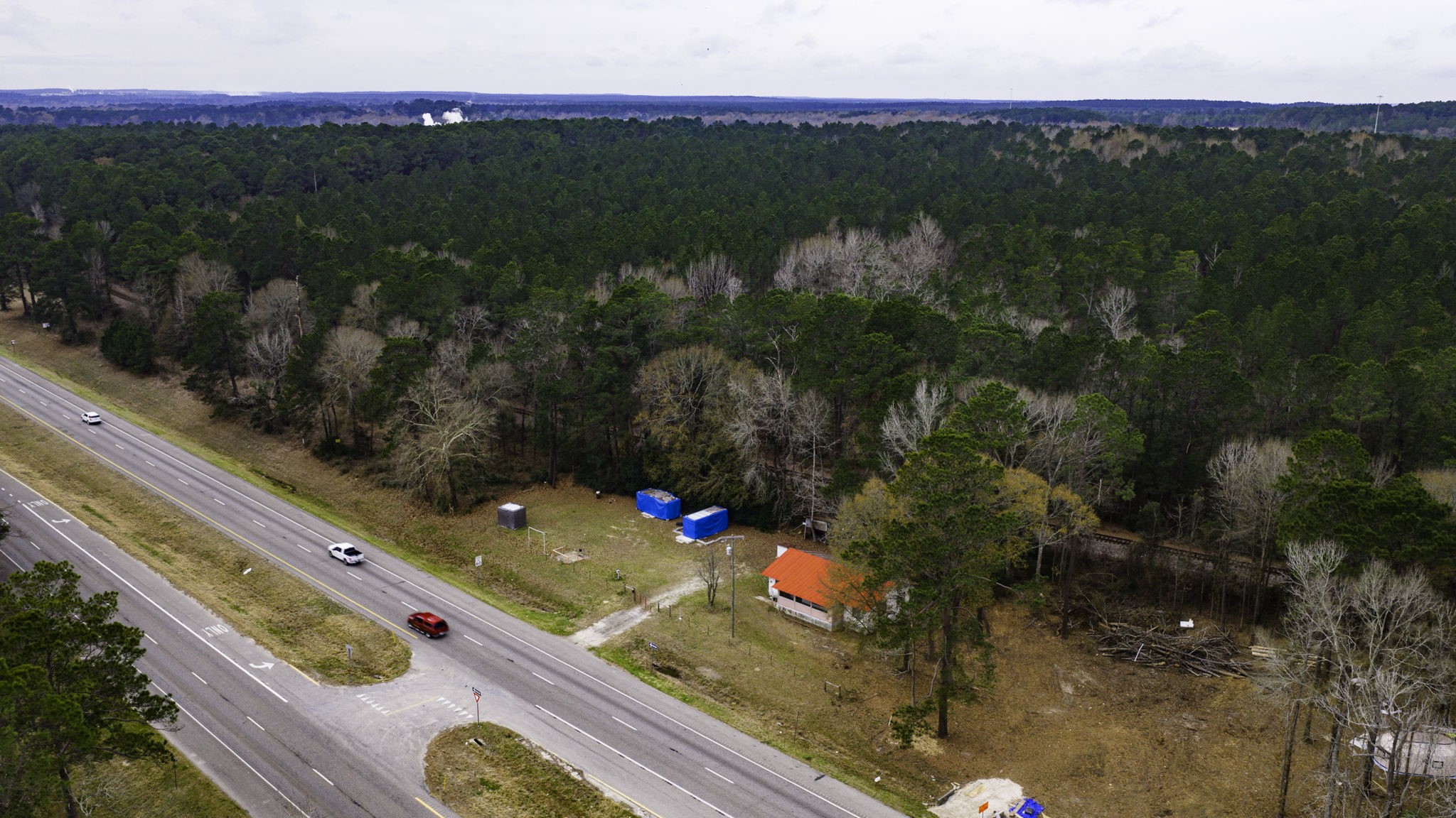 24103 Highway 59 Corrigan, TX 75939 - Photo 1 of 27 a view of a floor to ceiling window and a yard
