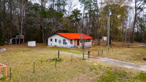 a view of swimming pool with sitting area