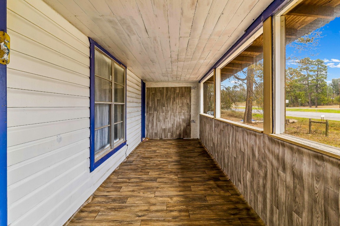 24103 Highway 59 Corrigan, TX 75939 - Photo 19 of 27 a view of a porch with wooden floor and stairs