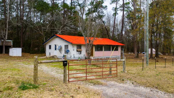 a view of a floor to ceiling window and an outdoor space