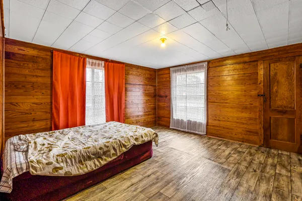 a bedroom with a bed and a walk in closet