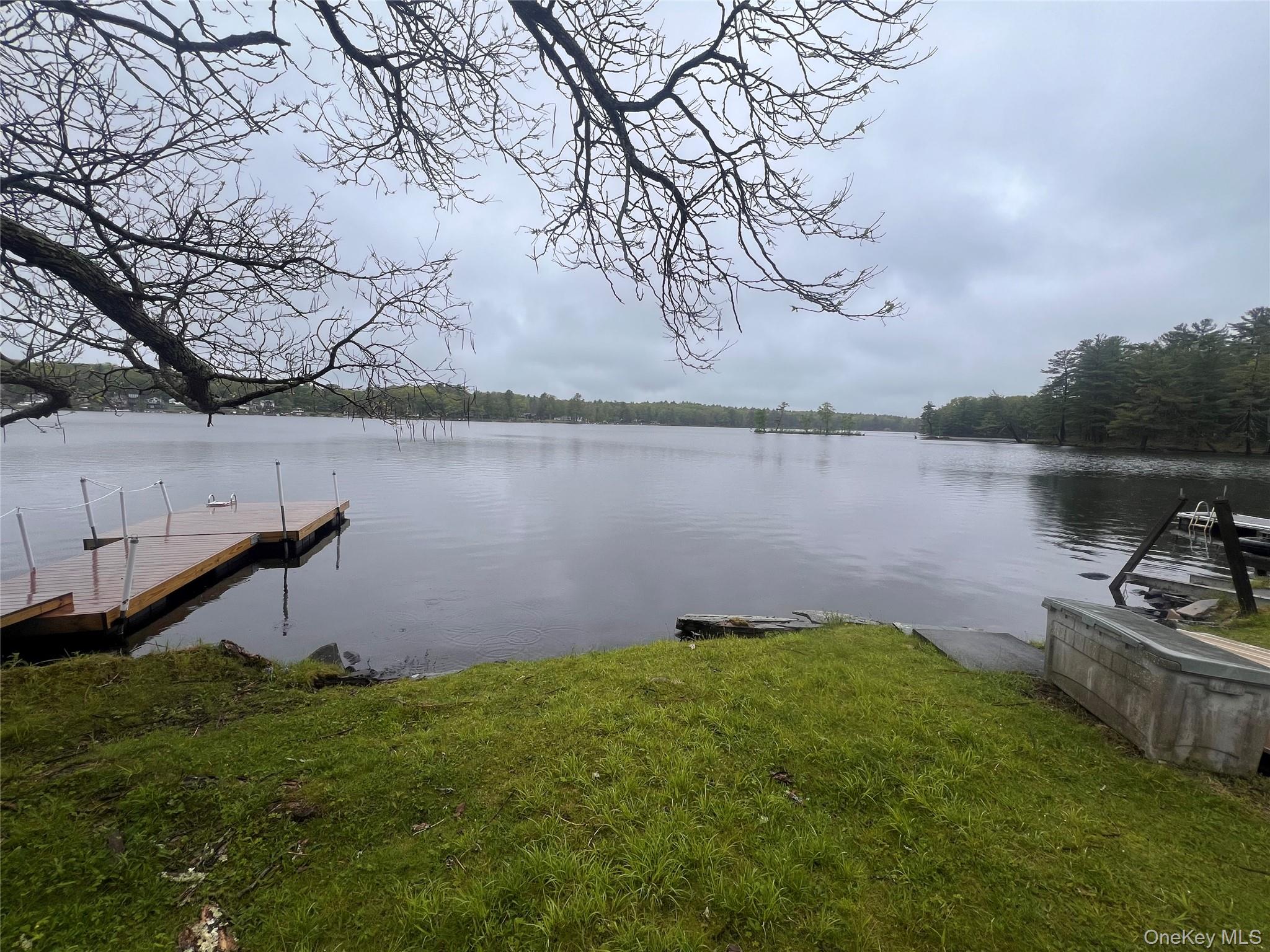 4 Beach Road, Unit G Glen Spey, NY 12737 - Photo 15 of 16 a backyard of a house with lots of green space and lake view