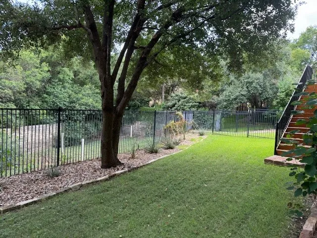 a view of a garden with a tree