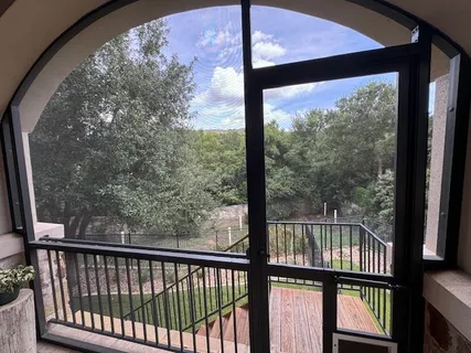 a view of a large window with an outdoor space