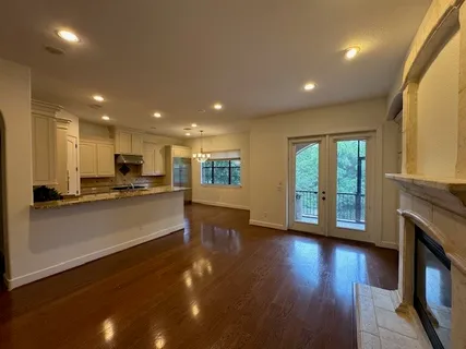 a view of kitchen with furniture and wooden floor