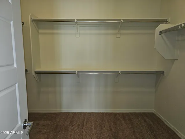 a bathroom with a double vanity sink a and a mirror