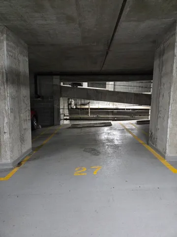 a view of room with wooden floor