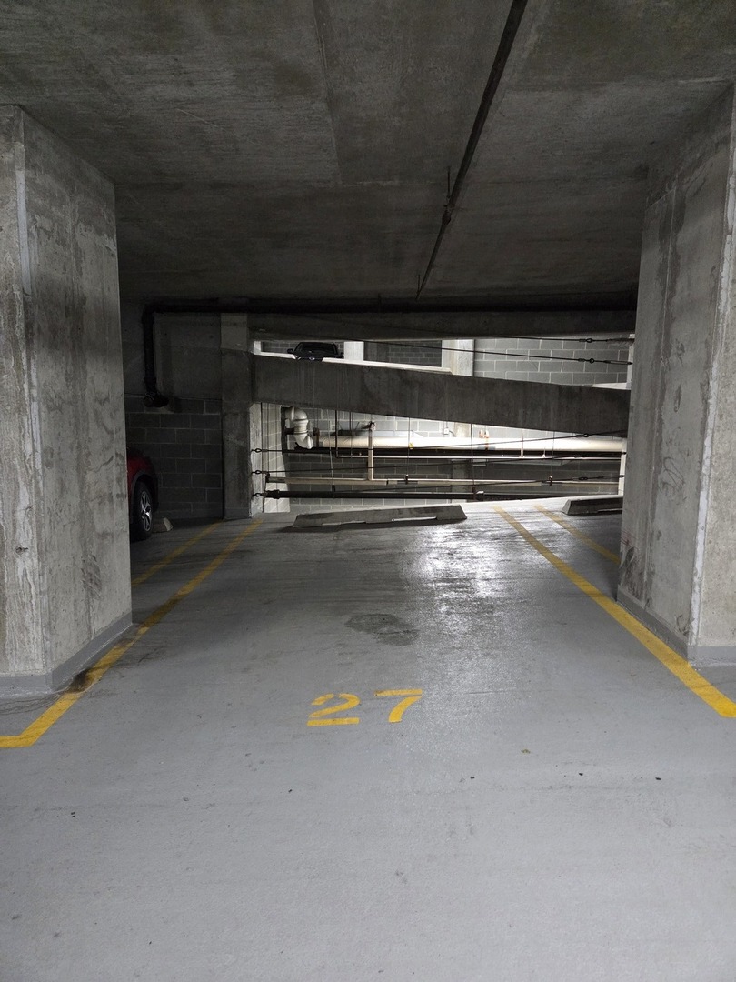 a view of room with wooden floor