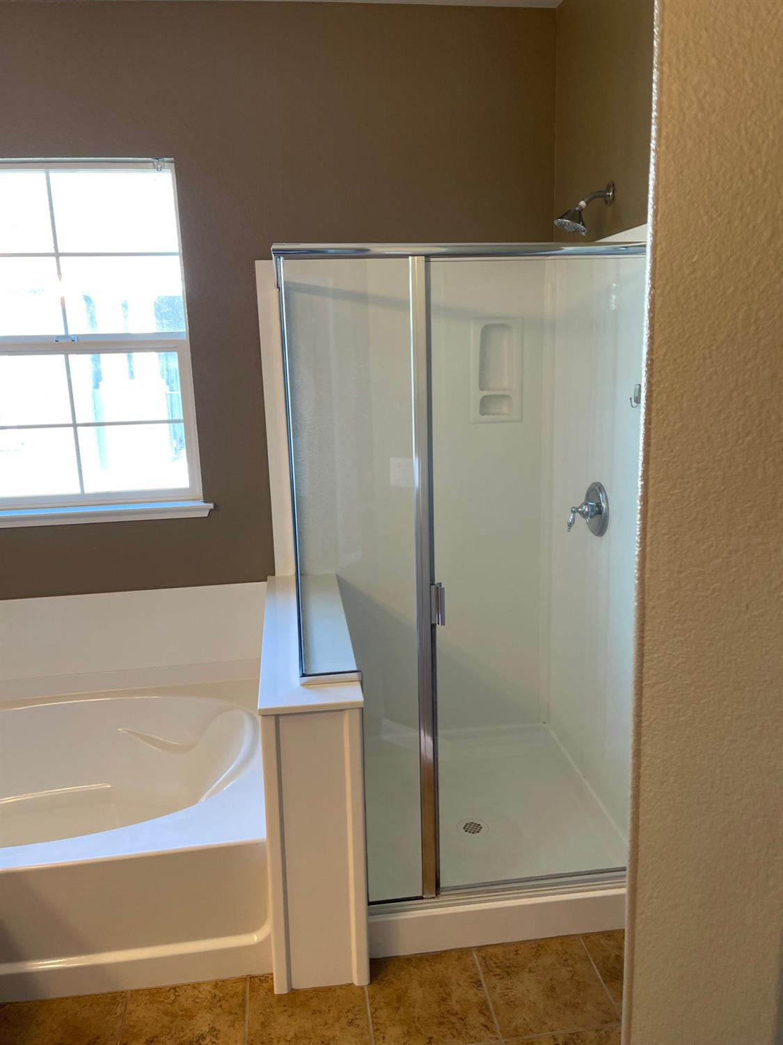 72 South Rio Rapido Drive Tracy, CA 95391 - Photo 17 of 24 a bathroom with a bathtub and a shower