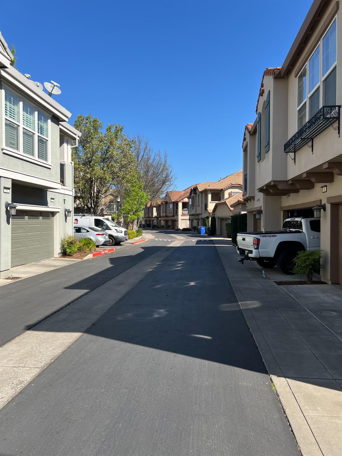 72 South Rio Rapido Drive Tracy, CA 95391 - Photo 21 of 24 a city street lined with buildings and cars
