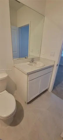 a bathroom with a sink and toilet