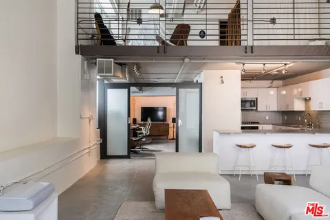 a view of a living room and entry way