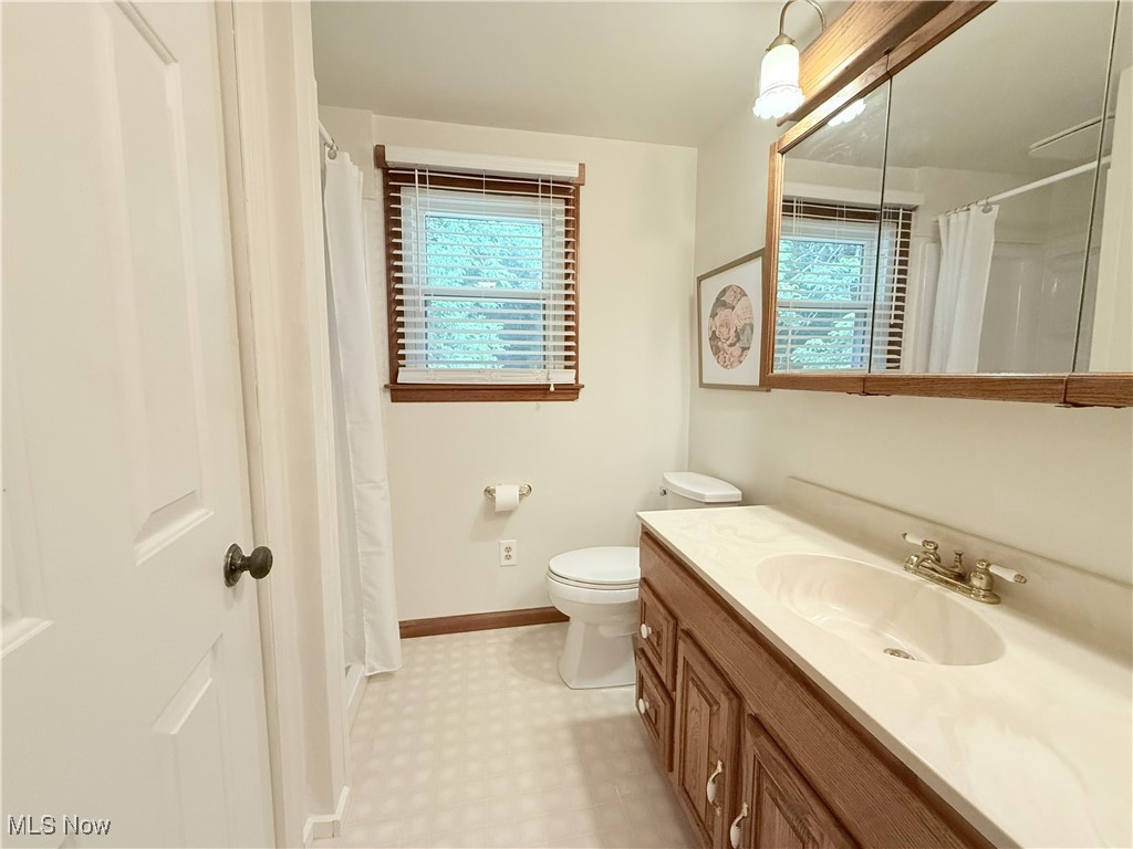4901 Kings Creek Road Weirton, WV 26062 - Photo 23 of 28 Full bath featuring vanity, a shower with shower curtain, and tile patterned floors