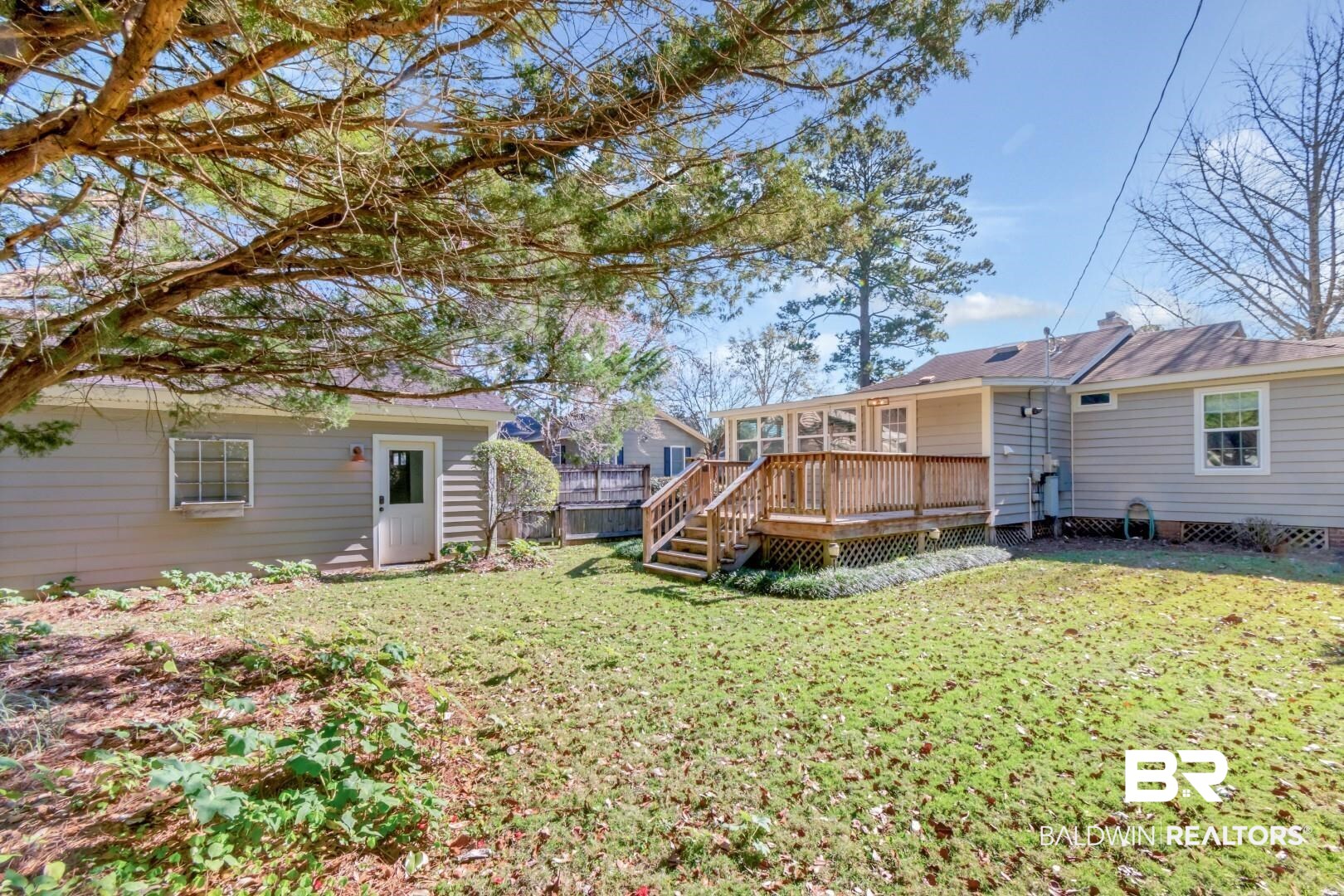 10 South Hathaway Road Mobile, AL 36608 - Photo 39 of 46 Back of house featuring a lawn and a deck