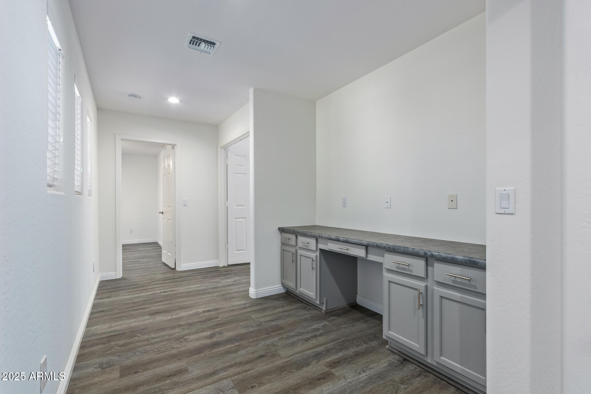 13635 West Calavar Road Surprise, AZ 85379 - Photo 55 of 76 a view of cabinets and wooden floor