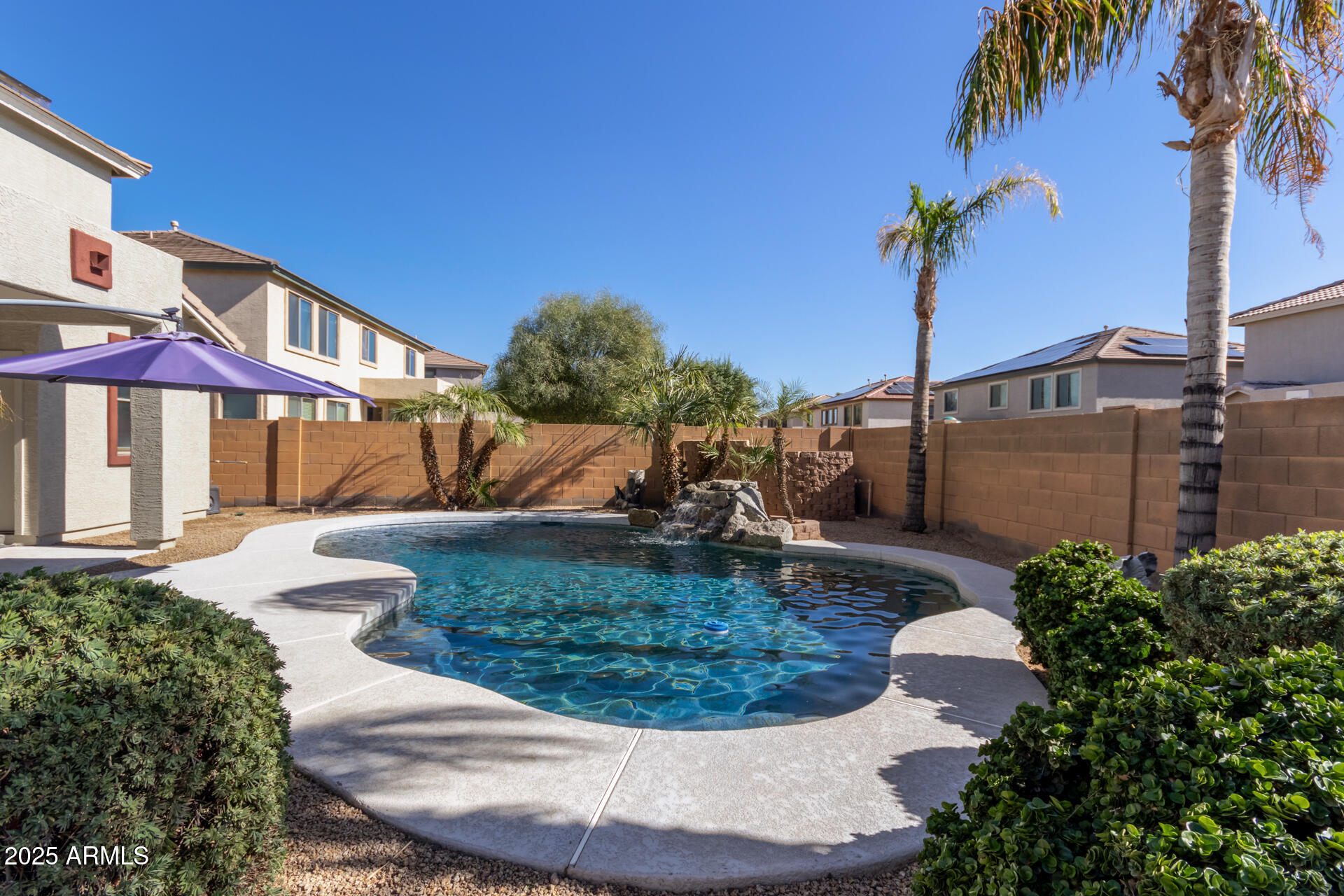 13635 West Calavar Road Surprise, AZ 85379 - Photo 71 of 76 a view of a house with a yard and potted plants
