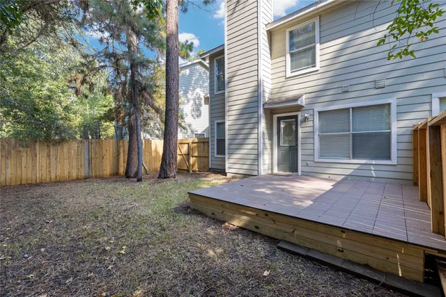 a wooden bench sitting in front of a house