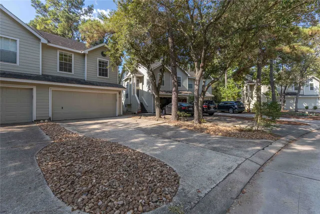 a view of a house with a snow on the road