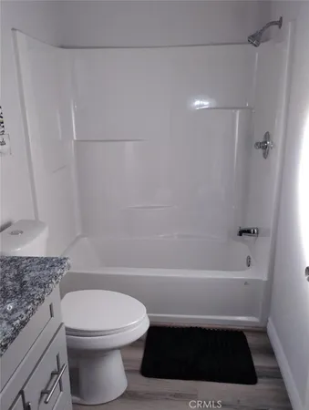 a living room with a couch and a flat screen tv